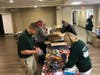 Volunteers stuff holiday stockings at Aberdeen's Fiorendo Sigismondi Cliffwood Beach Community Center.