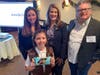 Brenna McCormick, 8, shows the box bearing her photo, with her mother, Laura, Assemblywoman Serena DiMaso and celebrity chef David Burke in Rumson Tuesday.