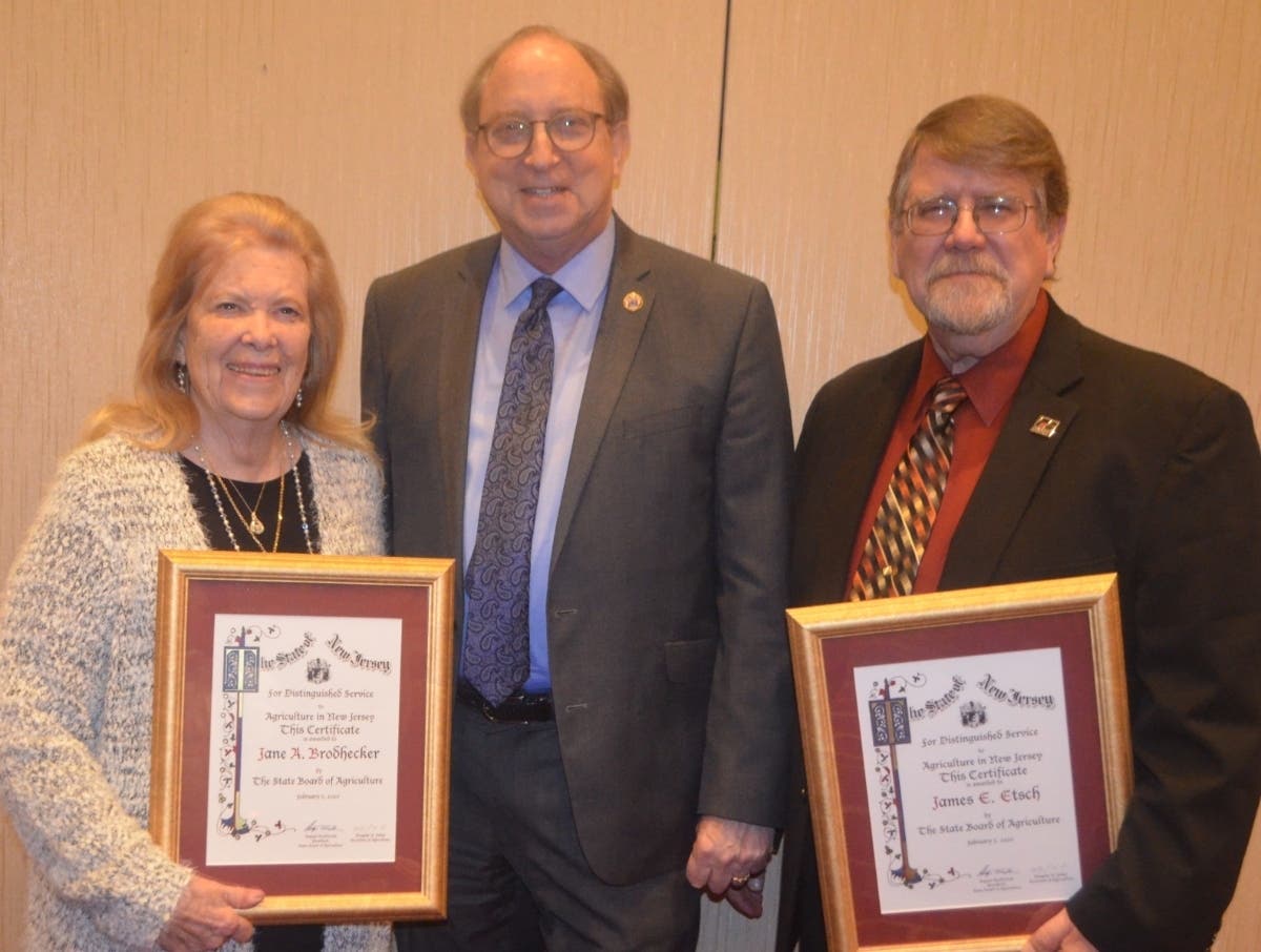 From left, award winner Jane Brodhecker, who owns Brodhecker Farm in Sussex County, NJ State Agriculture Secretary Doug Fisher, and award winner James Etsch of Etsch Farms.