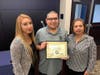 Aguirre, center, with his sister, Maria Aguirre​-Perez, and mother.