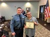 Ivan Aguirre with Red Bank Police Officer George Travostino. 