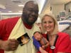 David Caldwell holds up the photo of himself as a pre-term baby, with nurse Lissa McGowan and his own son, Baby Zane Caldwell, born at three pounds, nine ounces.