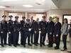 Police Chief Dennis Miller, center, with other officers and members of the Secaucus town council.