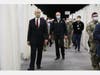 Gov. Murphy, wearing a black State Police pullover, walked with Sen. Booker, in a dark suit, on the tour. Both wore masks. 