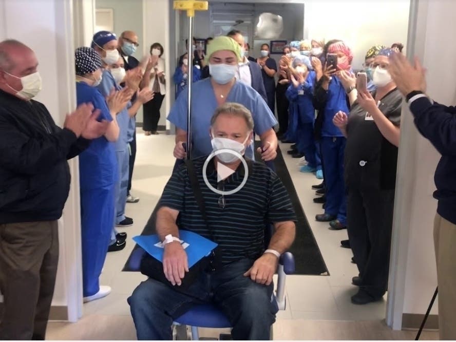 The South River resident is wheeled out.