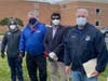 From right to left: Edison Mayor Tom Lankey, businessman Raj Pandya and former council members Len Sendelsky and Mike Lombardi waiting to greet residents outside Edison High School.