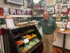 Steve Natoli stands in front of his expanded fresh fruit and vegetable section. His staff will deliver any produce to your home, with no minimum.