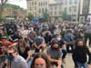 Protesters outside Jersey City City Hall kneeling.