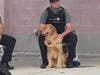 Secaucus Police Officer Taylor Ensmann with the department's beloved therapy dog, Oakley.