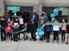 Woodbridge Mayor John McCormac cuts the ribbon at the Highland Grove Youth Center.