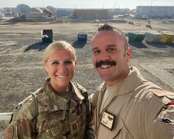 Capt. Kelliann Leli, left,  and her husband Capt. Jimmy Leli, take a photo together while both were deployed in the Middle East. This was the couple's last photo taken together.