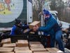  New York Giants players Joe Morris, David Tyree and Jonathan Casillas unload 1,500 turkeys donated by Stop & Shop in the days before Thanksgiving to MCFOODS.