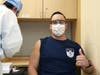 Armando Tamargo, an EMT at JFK, volunteered to be among the first to get the vaccine.