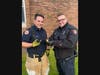 Firefighter Jago with Woodbridge Police Officer Marc Sokolow.