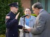 New Patrolman Jose Veliz, Jr. is sworn in as his grandfather, retired Aberdeen Police Officer and former Councilman Vincent Vinci, looks on.