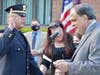 Newly promoted Lieutenant Roger Peter is sworn in as his family looks on.