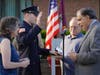 New Patrolman Christopher Vetter is sworn in as his parents look on.