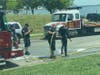 A State Police diver is hosed off.