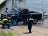 The truck is pulled from the water.