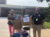 Bayview Elementary School nurse Janine with donated back-to-school supplies.