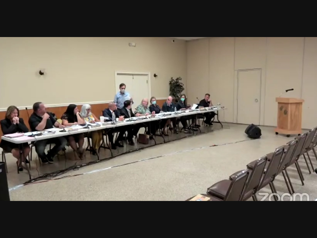 Middletown BOE attorney Bruce Padula tells board member Tom Giaimo to "please step away" from him at Wednesday night's meeting.