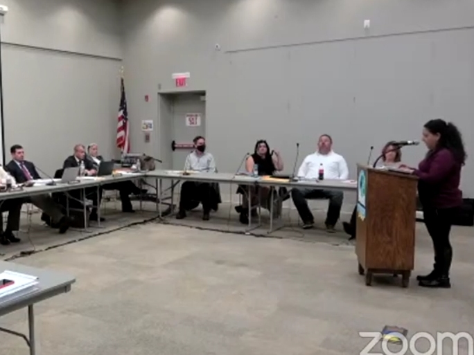 Mother Ann Marie Lusquinos voices her concerns before the school board Monday night.