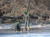 Park rangers check the ice thickness at Holmdel Park.