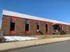 Where the grocery store will be located. The old karate building will not be torn down; it will be converted into a grocery store.