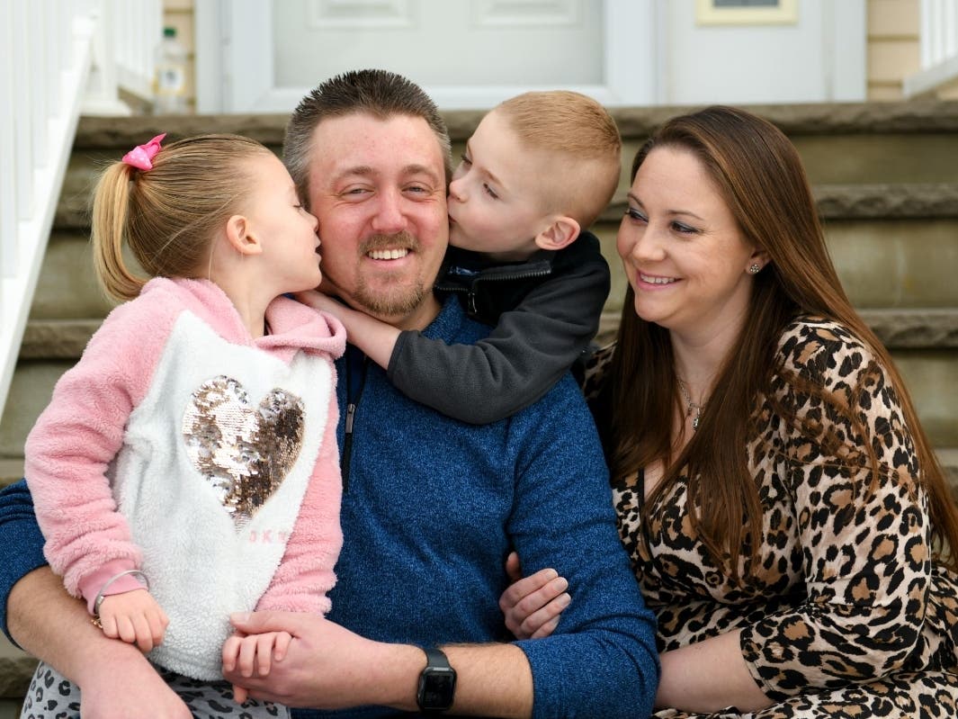 Buhler with his wife, Andra, and their twins, Zaylee and Zachary.