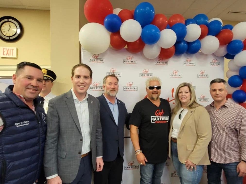 Guy Fieri, center, with members of the Middletown Township Committee on Friday.