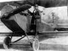 A public domain photo of Bessie Coleman and her plane in 1922.