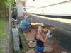 Richard Rotondo and his daughter, Nicole, working on the family boat in their Middletown driveway.