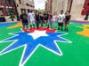 The mural was made under the direction of the African-Latino artist Louis-Miguel "Louie Blaka" Caraballo, and any member of the public was invited to participate, starting at 9 a.m. Friday.