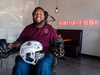 LeGrand with one of the new helmets bearing the logo of his coffee shop.