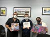 Middletown IMA Urgent Care's Dr. Soliman, radiology tech Michael and physician assistant Victoria helping to collect toys.