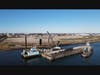 The dredging that just started this week. Behind the dredge boat, along the shore is the steel bulkhead that was just installed in November.