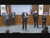 Woodbridge Mayor John McCormac, Officer Michael Carroll and Officer Stephanie Lage.