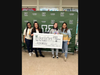 Santana, second from left, with the JFK High School teens who raised the money.