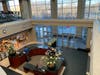 A view from the open-floor workout area into the main lobby below.