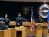 Det. Sean Egan, center, worked with federal agents and U.S. Attorneys.