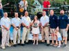 Molly Frank, 24, pictured with Middletown firefighters, Chief John Waltz, Mayor Tony Perry and Committeeman Ryan Clarke.