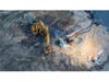 A local photographer on the Bayshore took these photos of the excavator stuck in the sand.