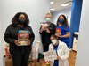 Also last November, IMA Urgent Care staff at their Port Monmouth location thank clients for donating.