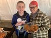 Jennifer McCue and her son Daniel, 12, of Matawan, show their ribbon and what remains of their pie.