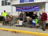 Middletown Helps Its Own volunteers Bob Monahan, Keith MacDonald, Sharon Copeland and Robert Castner help load donations.