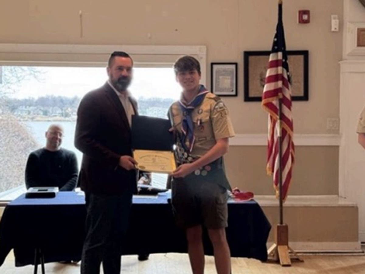 Middletown Committeeman Ryan Clarke, left, who is also an Eagle Scout, gives Ryan Colley a certificate of commendation on March 7.