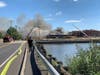 The waterfront restaurant at RiverWalk when it caught fire last August, due to insulation being installed on its roof.
