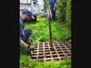 They used a crane from the DPW service truck to pry the lid off the storm drain.
