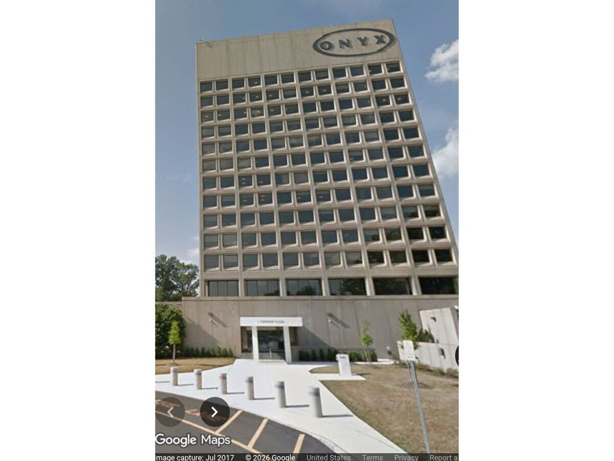 The nine-story NJ Turnpike Authority building in Woodbridge. It was evacuated Tuesday after smoke was seen from its rooftop.