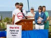 Matt Smith of Food & Water Watch protests the Raritan Bay NESE natural gas pipeline last September. He stands here in front of Raritan Bay, in Middletown.